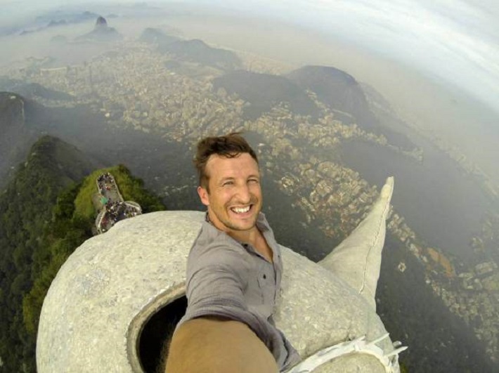 Lee Thompson on the Top of Christ the Redeemer Statue in Brazil